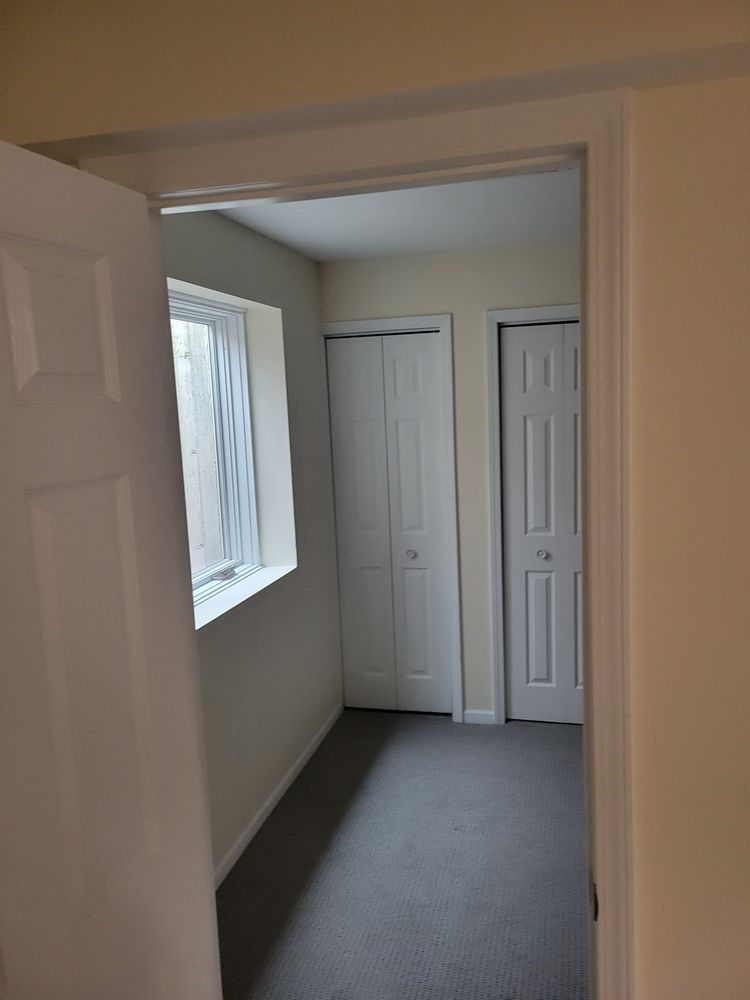 Finished basement with modern lighting