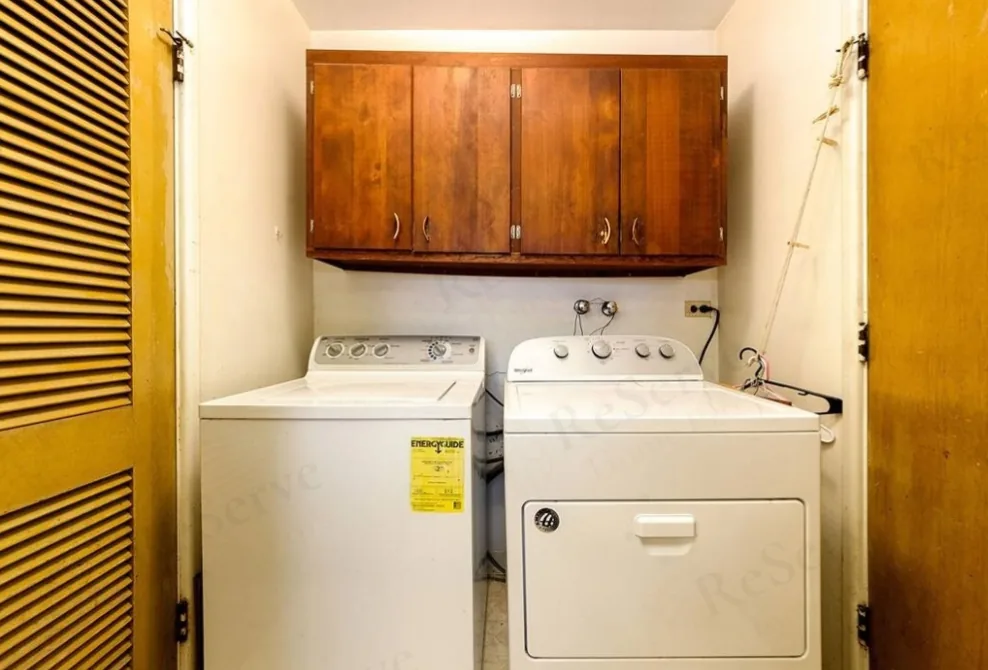 Before: Laundry area rebuilt: walls, doors and hookups.